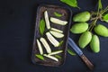 Fresh green mango fruit sliced Ã¢â¬â¹Ã¢â¬â¹on a tray.